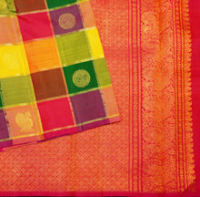 Load image into Gallery viewer, Full Flat Lay of Rainbow Kattam Kanchipuram Silk Saree showing Multi-Colour Check Body and Grand Red-Orange Annam Gold Zari Brocade Pall
