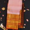 Baby pink Kanchipuram silk saree with gold annam butta motifs and orange-gold Korvai border