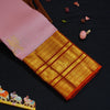 Baby pink Kanchipuram silk saree with gold annam butta motifs and orange-gold Korvai border