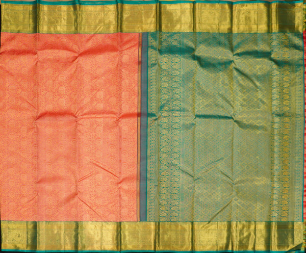 close view of premium bridal kanchipuram silk saree in peach orange colour with korvai border