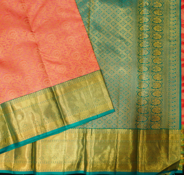 close view of premium bridal kanchipuram silk saree in peach orange colour with korvai border