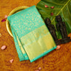 Close view of premium bridal kanchipuram silk saree in anandha colour with folral zari jaal