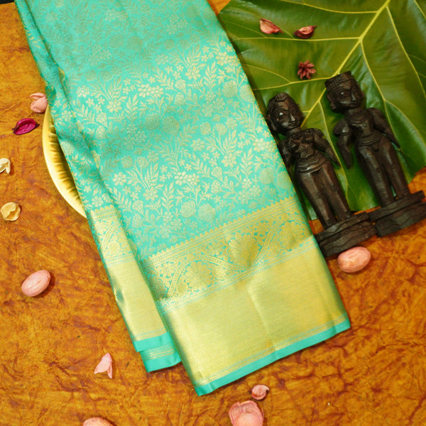 Close view of premium bridal kanchipuram silk saree in anandha colour with folral zari jaal