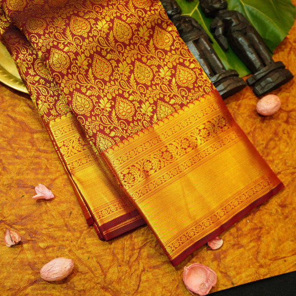 Close view of premium bridal kanchipuram silk saree in coffee brown colour with floral vine design