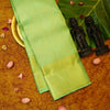 Close view of premium bridal kanchipuram silk saree in pastel green colour with geomentric floral design