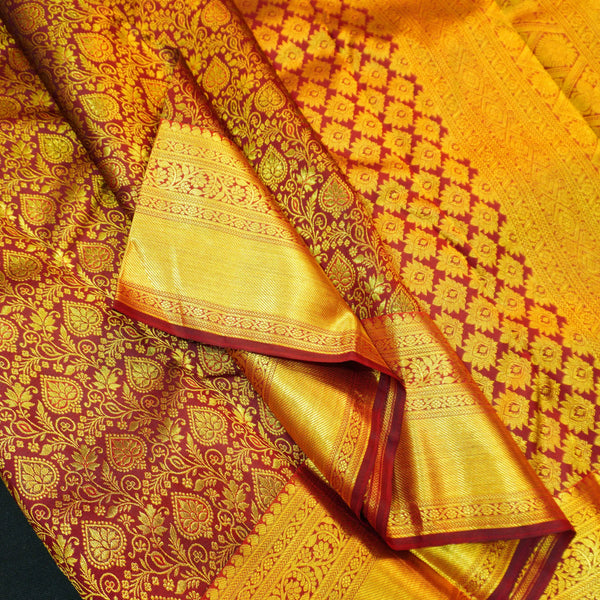 Close view of premium bridal kanchipuram silk saree in coffee brown colour with floral vine design