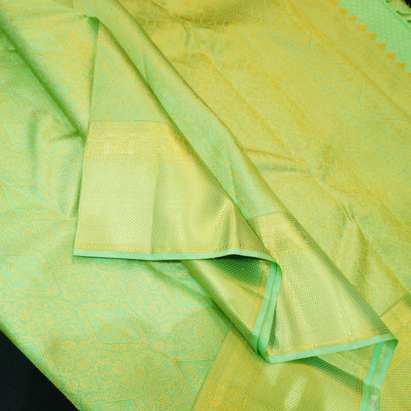 Close view of premium bridal kanchipuram silk saree in pastel green colour with geomentric floral design