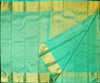 Close view of premium bridal kanchipuram silk saree in anandha colour with folral zari jaal