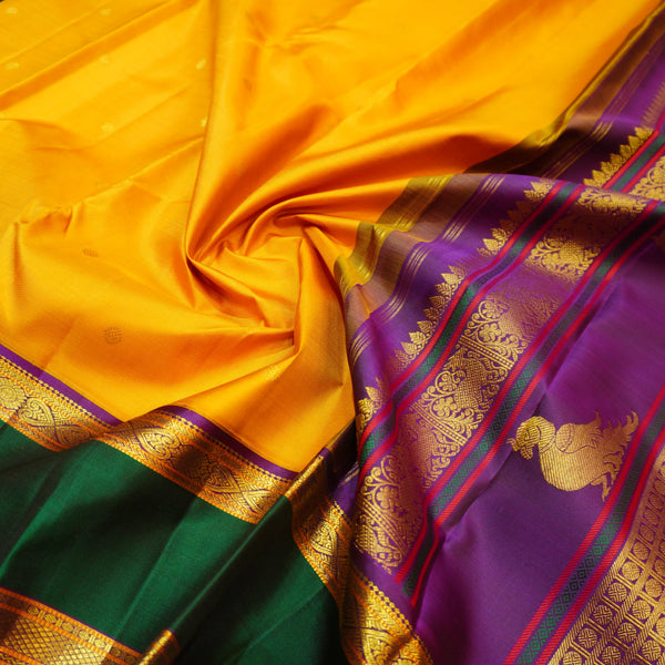 Premeium Traditional kanchipuram silk saree in Mustard Yellow colour with retta pettu korvai border