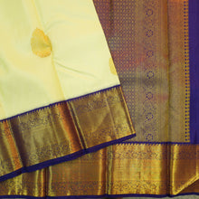 Load image into Gallery viewer, Lemon yellow vintage Kanchipuram silk saree with navy blue korvai border, featuring gold floral thilagam motifs on the body and a richly woven traditional zari pallu.