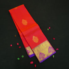 Load image into Gallery viewer, Tomato red Kanchipuram silk saree with violet zari border and pallu, featuring gold thilagam motifs.