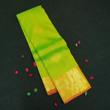 Load image into Gallery viewer, Parrot green Kanchipuram silk saree with pink orange zari border and gold buttas, traditional pattu saree for wedding wear.