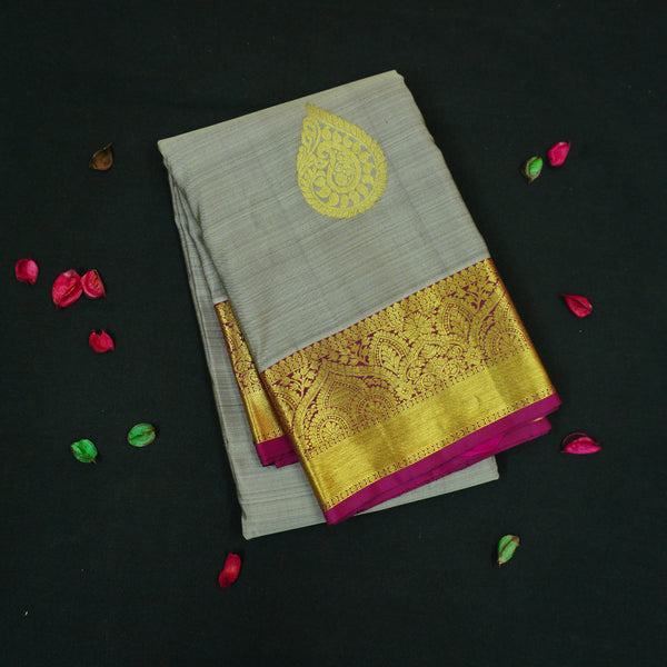 Elephant gray Kanchipuram silk saree with magenta border, gold thilagam motifs on the body, and rich zari pallu – traditional wedding saree from Vivaaha Silks.