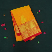 Load image into Gallery viewer, Mango yellow Kanchipuram silk saree with gold zari mango butta motifs, traditional red border, and rich pallu – bridal silk saree by Vivaaha Silks.
