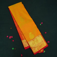 Load image into Gallery viewer, Mango yellow Kanchipuram silk saree with gold zari mango butta motifs, traditional red border, and rich pallu – bridal silk saree by Vivaaha Silks.