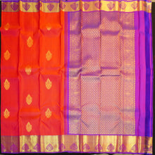 Load image into Gallery viewer, Tomato red Kanchipuram silk saree with violet zari border and pallu, featuring gold thilagam motifs.