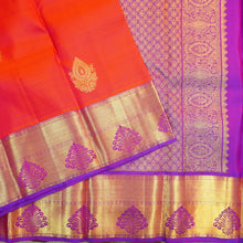Load image into Gallery viewer, Tomato red Kanchipuram silk saree with violet zari border and pallu, featuring gold thilagam motifs.