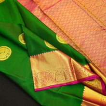 Load image into Gallery viewer, Bottle green Kanchipuram silk saree with magenta border, rich gold zari pallu, and round zari motifs – traditional South Indian wedding saree from Vivaaha Silks.
