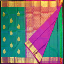 Load image into Gallery viewer, Peacock blue Kanchipuram silk saree with gold zari thilagam butta motifs, violet border, and rich woven pallu – traditional bridal silk saree by Vivaaha Silks.