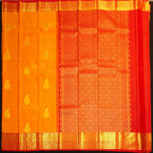 Load image into Gallery viewer, Mango yellow Kanchipuram silk saree with gold zari mango butta motifs, traditional red border, and rich pallu – bridal silk saree by Vivaaha Silks.