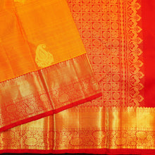 Load image into Gallery viewer, Mango yellow Kanchipuram silk saree with gold zari mango butta motifs, traditional red border, and rich pallu – bridal silk saree by Vivaaha Silks.