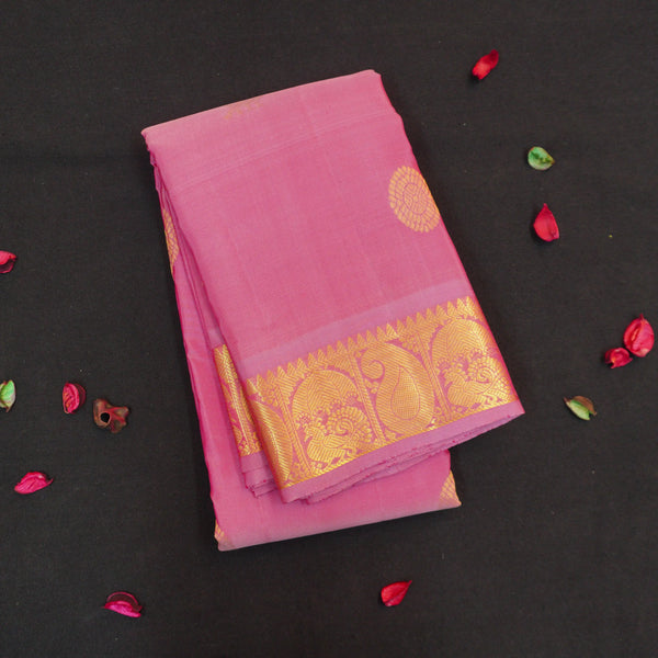 Baby pink Kanchipuram silk saree from Vivaaha Silks budget collection with golden annam and chakaram butta, rich zari pallu and traditional border.