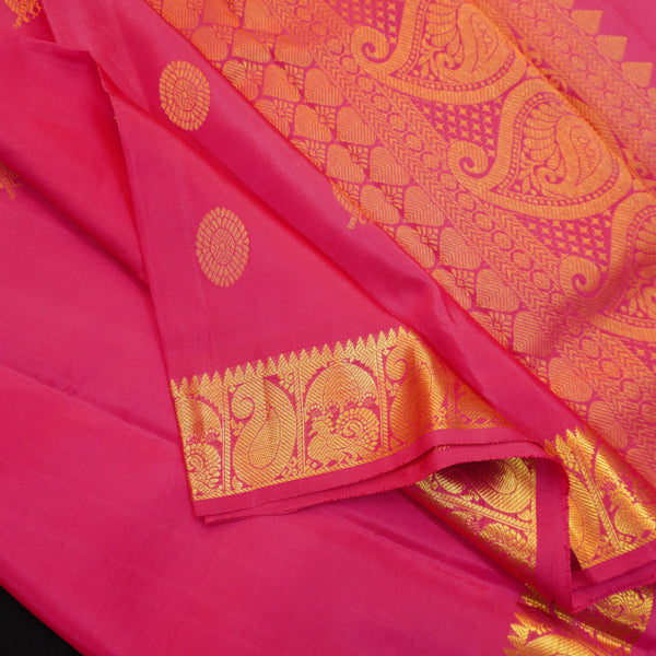 Peach pink Kanchipuram silk saree with gold annam and chakaram butta motifs, rich zari pallu, and traditional temple border – perfect for bridal and festive wear from Vivaaha Silks.