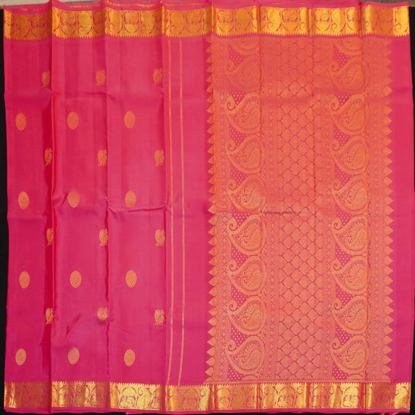 Peach pink Kanchipuram silk saree with gold annam and chakaram butta motifs, rich zari pallu, and traditional temple border – perfect for bridal and festive wear from Vivaaha Silks.