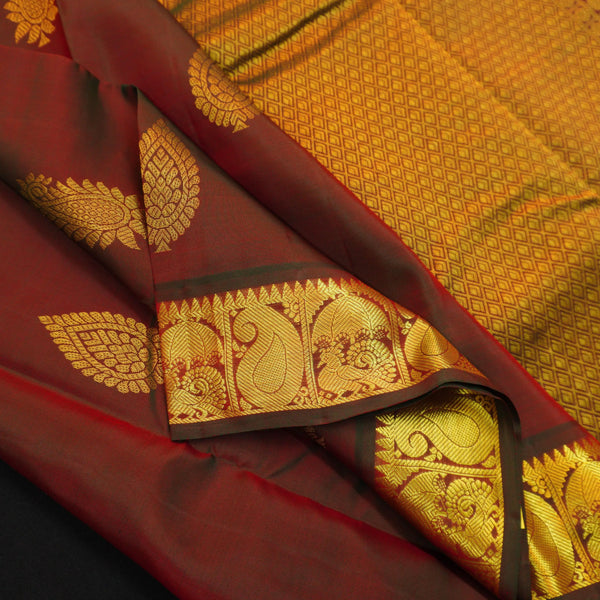 Manthulir short color Kanchipuram silk saree from Vivaaha Silks budget collection featuring golden thilagam buttas and rich zari pallu with traditional border.