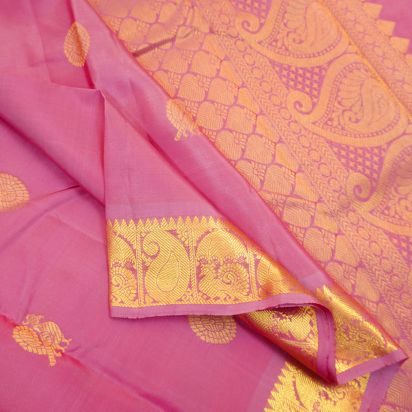 Baby pink Kanchipuram silk saree from Vivaaha Silks budget collection with golden annam and chakaram butta, rich zari pallu and traditional border.