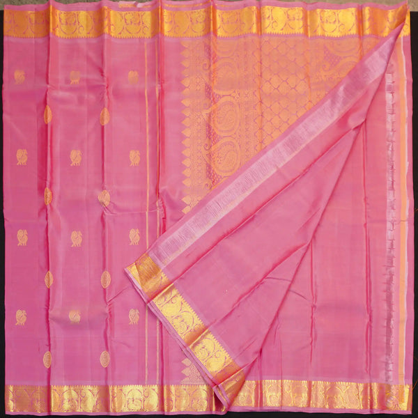 Baby pink Kanchipuram silk saree from Vivaaha Silks budget collection with golden annam and chakaram butta, rich zari pallu and traditional border.