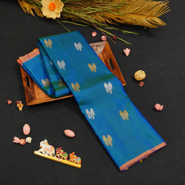 Peacock Blue Borderless Silk Saree with Twin Parrot Butta in Gold and Silver Zari
