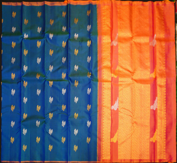 Peacock Blue Borderless Silk Saree with Twin Parrot Butta in Gold and Silver Zari