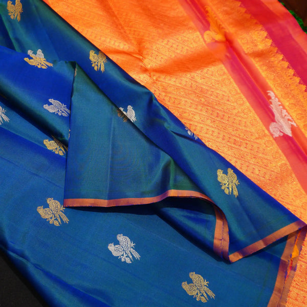 Peacock Blue Borderless Silk Saree with Twin Parrot Butta in Gold and Silver Zari