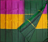 A folded and draped silk saree with a bold block pattern of magenta pink, golden yellow, and forest green, accented with thin gold zari borders.