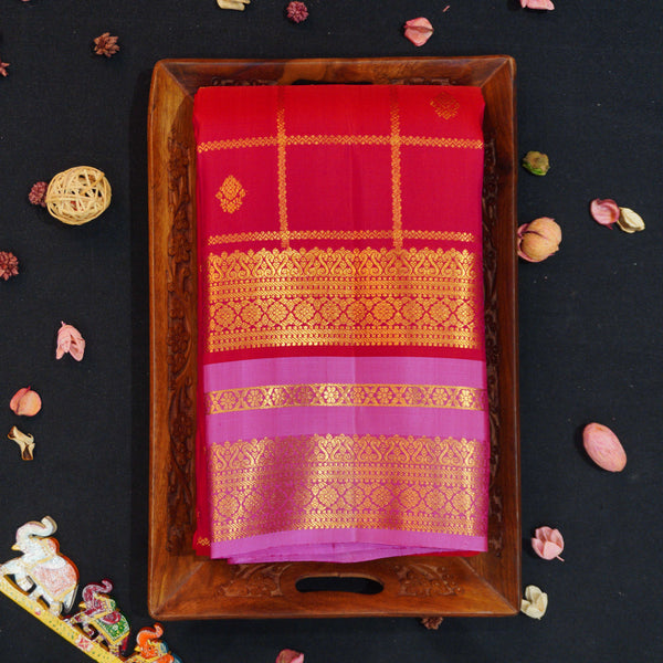 Red Kanchipuram silk saree with kattam jaal, vatta butta and pink Tharai Jaal border