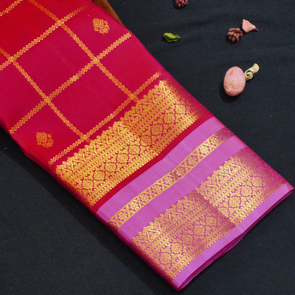 Red Kanchipuram silk saree with kattam jaal, vatta butta and pink Tharai Jaal border