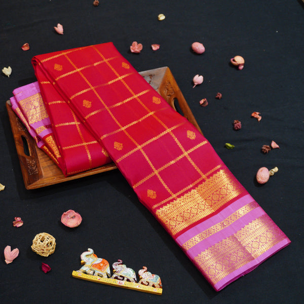 Red Kanchipuram silk saree with kattam jaal, vatta butta and pink Tharai Jaal border