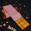 Baby pink Kanchipuram silk saree with gold annam butta motifs and orange-gold Korvai border