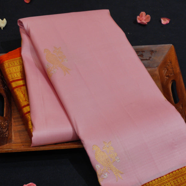 Baby pink Kanchipuram silk saree with gold annam butta motifs and orange-gold Korvai border