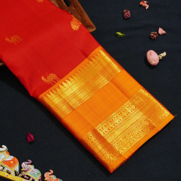 Red with Orange Retta Pettu Border Kanchipuram Silk Saree with Camel & Peacock motif