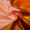 Baby pink Kanchipuram silk saree with gold annam butta motifs and orange-gold Korvai border