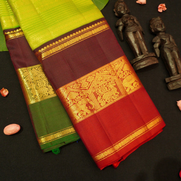premium veldhari zaari lines kanchipuram silk saree in parrot green 