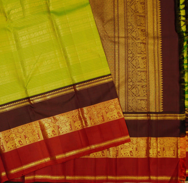 premium veldhari zaari lines kanchipuram silk saree in parrot green 