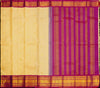 A close-up of a fabric textile laid flat, showing a cream-yellow body with small gold motifs and a wide magenta-purple border with gold woven detailing.
