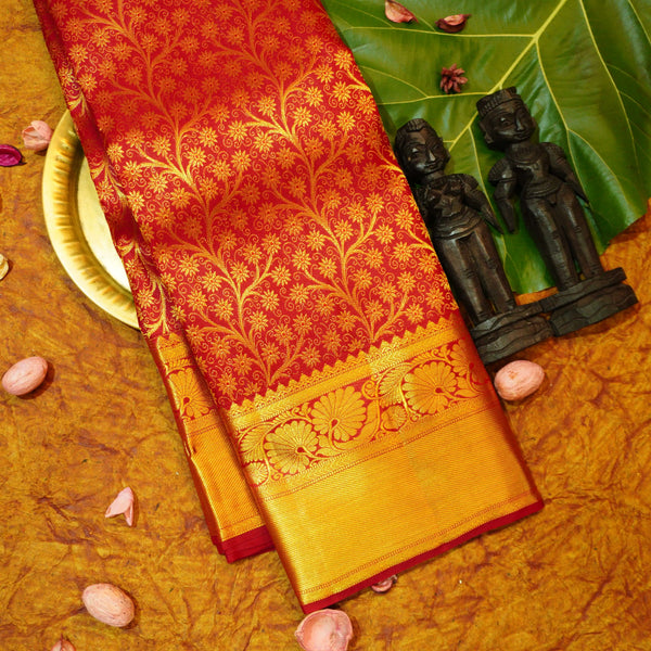 Close view of premium bridal kanchipuram silk saree in bridal red colour with creeping floral design
