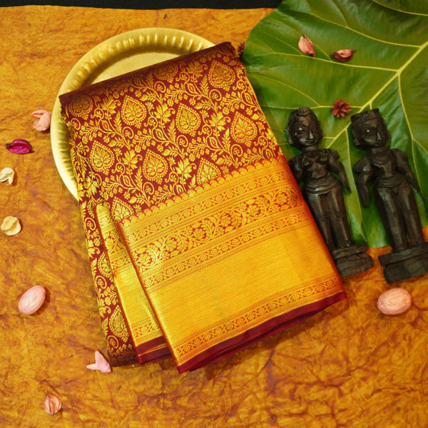 Close view of premium bridal kanchipuram silk saree in coffee brown colour with floral vine design