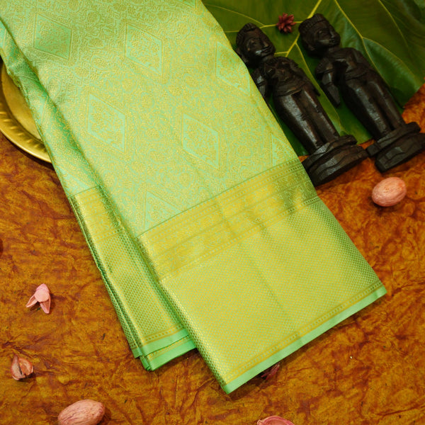 Close view of premium bridal kanchipuram silk saree in pastel green colour with geomentric floral design