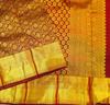 Close view of premium bridal kanchipuram silk saree in coffee brown colour with floral vine design