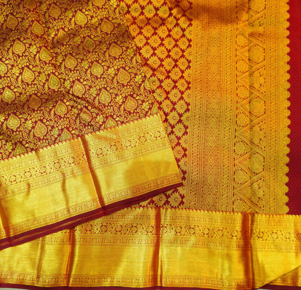 Close view of premium bridal kanchipuram silk saree in coffee brown colour with floral vine design
